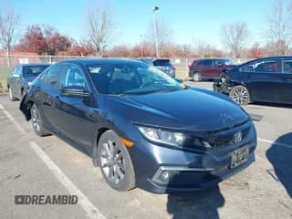 ✅ 2019 Honda Civic EX • VIN: 19XFC1F34KE204349 • Lot: 43780668. Listed on IAAI with 70,089 mi. Free auction sales archive from the USA and detailed vehicle history report at DreamBid. Image 1.