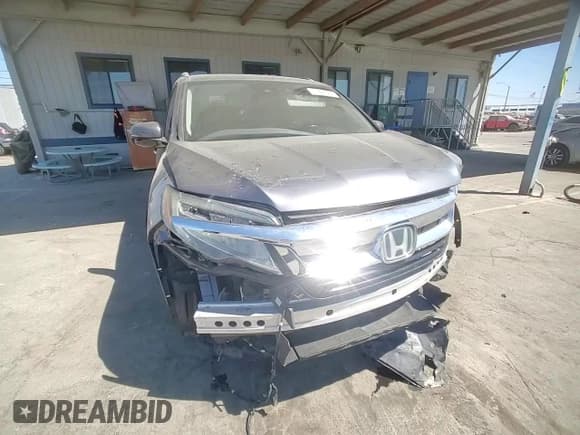 ✅ 2019 Honda Pilot Touring 8-Passenger • VIN: 5FNYF5H90KB043176 • Lot: 71208325. Listed on Copart with 56,580 mi. Free auction sales archive from the USA and detailed vehicle history report at DreamBid. Image 14.