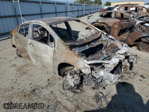 ✅ 2022 Toyota Prius LE • VIN: JTDKAMFP6N3197411 • Lot: 59794995. Listed on Copart with Not provided. Free auction sales archive from the USA and detailed vehicle history report at DreamBid. Image 4.