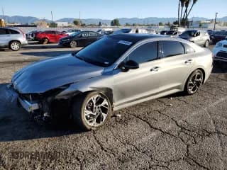 ✅ 2025 Kia K5 GT-Line • VIN: KNAG64J77S5353340 • Lot: 87250695. Listed on Copart with 10,913 mi. Free auction sales archive from the USA and detailed vehicle history report at DreamBid. Image 1.