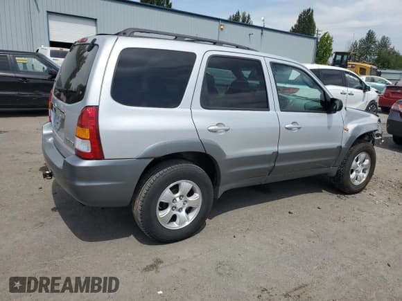 ✅ 2001 Mazda Tribute LX • VIN: 4F2CU08171KM64973 • Lot: 67452495. Listed on Copart with 160,864 mi. Free auction sales archive from the USA and detailed vehicle history report at DreamBid. Image 3.