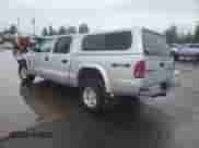 2003 Dodge Dakota Sport z VIN 1D7HG38N83S265442, wystawiony jako Copart lot #84969985 z przebiegiem Nie podano mil oraz Szkoda całkowita • Salvage title. Historia ofert i sprzedaży dostępna na DreamBid. Obrazek 2.