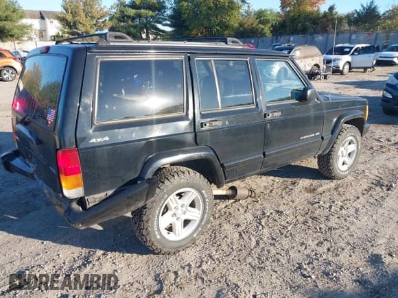 ✅ 2001 Jeep Cherokee Sport • VIN: 1J4FF58S61L530804 • Lot: 43519957. Listed on IAAI with 128,418 mi. Free auction sales archive from the USA and detailed vehicle history report at DreamBid. Image 4.