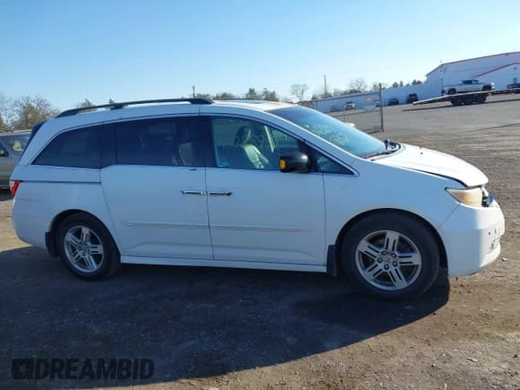 ✅ 2011 Honda Odyssey Touring • VIN: 5FNRL5H93BB053052 • Lot: 43788957. Listed on IAAI with 178,627 mi. Free auction sales archive from the USA and detailed vehicle history report at DreamBid. Image 13.
