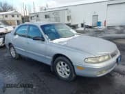 ✅ 1995 Mazda 626 • VIN: 1YVGE22D1S5309021 • Lot: 43854603. Listed on IAAI with 97,053 mi. Free auction sales archive from the USA and detailed vehicle history report at DreamBid. Image 1.