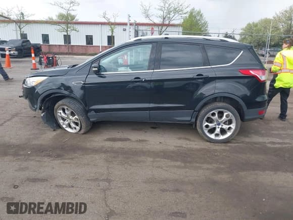 ✅ 2013 Ford Escape Titanium • VIN: 1FMCU9J9XDUC53579 • Lot: 42166603. Listed on IAAI with 112,736 mi. Free auction sales archive from the USA and detailed vehicle history report at DreamBid. Image 14.