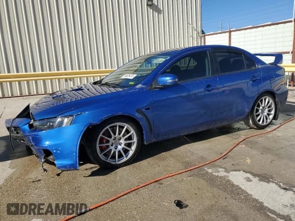 ✅ 2015 Mitsubishi Lancer Evolution GSR • VIN: JA32W8FV6FU006930 • Lot: 84628474. Listed on Copart with 116,819 mi. Free auction sales archive from the USA and detailed vehicle history report at DreamBid. Image 1.