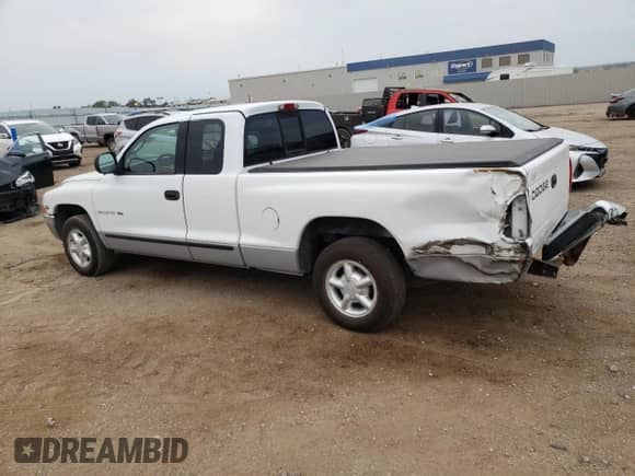 2000 Dodge Dakota z VIN 1B7GL22X4YS517720, wystawiony jako Copart lot #66695224 z przebiegiem 124 207 mil mil oraz Szkoda całkowita • Salvage title. Historia ofert i sprzedaży dostępna na DreamBid. Obrazek 2.