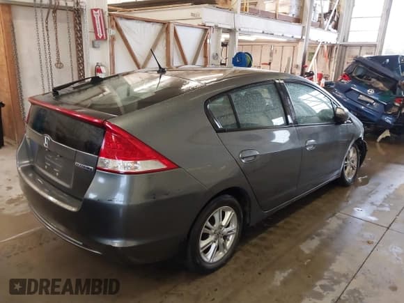 ✅ 2011 Honda Insight EX • VIN: JHMZE2H73BS001963 • Lot: 43557485. Listed on IAAI with 199,204 mi. Free auction sales archive from the USA and detailed vehicle history report at DreamBid. Image 4.