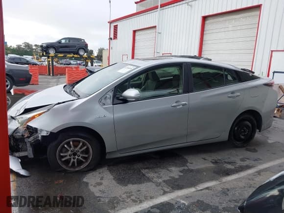 ✅ 2016 Toyota Prius Four • VIN: JTDKARFU4G3519274 • Lot: 43704038. Listed on IAAI with 131,497 mi. Free auction sales archive from the USA and detailed vehicle history report at DreamBid. Image 15.