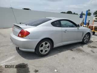 2004 Hyundai Tiburon GS с VIN KMHHM65D44U105236, выставлен на аукционе Copart как лот 67358735 с пробегом 166 537 миль миль и Списание • Salvage title. История ставок и продаж доступна на DreamBid. Изображение 3.