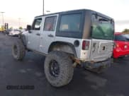 ✅ 2012 Jeep Wrangler Unlimited Sport • VIN: 1C4BJWDG8CL143023 • Lot: 43447646. Listed on IAAI with 119,924 mi. Free auction sales archive from the USA and detailed vehicle history report at DreamBid. Image 3.