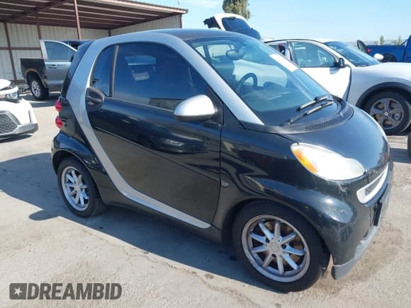 ✅ 2009 Smart fortwo Pure • VIN: WMEEJ31X19K220847 • Lot: 42817145. Listed on IAAI with 130,888 mi. Free auction sales archive from the USA and detailed vehicle history report at DreamBid. Image 1.