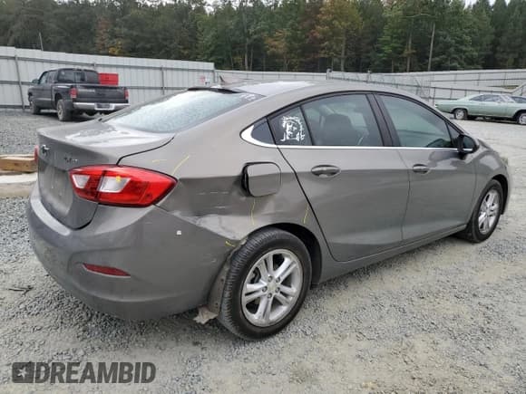 ✅ 2018 Chevrolet Cruze LT • VIN: 1G1BE5SMXJ7246580 • Lot: 81863505. Listed on Copart with 93,506 mi. Free auction sales archive from the USA and detailed vehicle history report at DreamBid. Image 3.