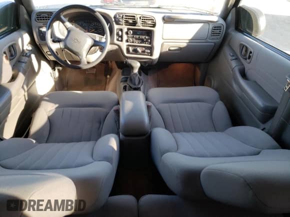 2005 Chevrolet Blazer LS z VIN 1GNCT18X55K110900, wystawiony jako Copart lot #76983804 z przebiegiem 59 765 mil mil oraz Szkoda całkowita • Salvage title. Historia ofert i sprzedaży dostępna na DreamBid. Obrazek 8.