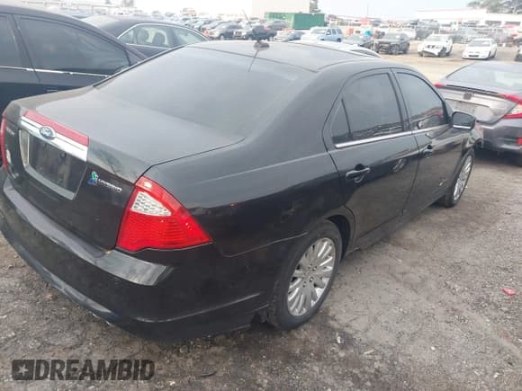 ✅ 2011 Ford Fusion Hybrid • VIN: 3FADP0L37BR171324 • Lot: 41775564. Listed on IAAI with 169,496 mi. Free auction sales archive from the USA and detailed vehicle history report at DreamBid. Image 4.