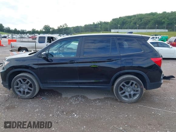 ✅ 2023 Honda Passport EX-L • VIN: 5FNYF8H56PB020149 • Lot: 42777091. Listed on IAAI with 39,419 mi. Free auction sales archive from the USA and detailed vehicle history report at DreamBid. Image 14.