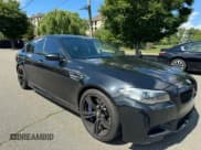 ✅ 2015 BMW M5 • VIN: WBSFV9C56FD595096 • Lot: 76574074. Listed on Copart with 61,779 mi. Free auction sales archive from the USA and detailed vehicle history report at DreamBid. Image 1.