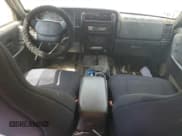 ✅ 1999 Jeep Cherokee Sport • VIN: 1J4FT68S0XL589158 • Lot: 71464305. Listed on Copart with Not provided. Free auction sales archive from the USA and detailed vehicle history report at DreamBid. Image 8.