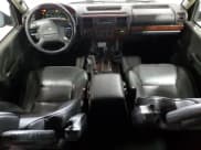 ✅ 2004 Land Rover Discovery SE • VIN: SALTY19404A843478 • Лот: 90023555. Опубликован ранее на Copart с пробегом 141 054 миль. Бесплатный доступ к архиву аукционных продаж из США и подробный отчёт об истории автомобиля на DreamBid. Изображение 8.