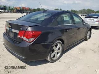 ✅ 2015 Chevrolet Cruze LT • VIN: 1G1PE5SBXF7223134 • Lot: 54080322. Listed on Copart with 56,651 mi. Free auction sales archive from the USA and detailed vehicle history report at DreamBid. Image 4.