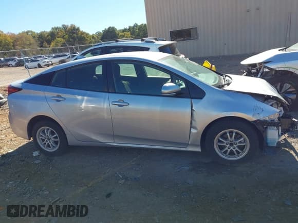 ✅ 2021 Toyota Prius L Eco • VIN: JTDKAMFU9M3143122 • Lot: 43486623. Listed on IAAI with 81,483 mi. Free auction sales archive from the USA and detailed vehicle history report at DreamBid. Image 13.