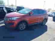 2015 Hyundai Santa Fe z VIN 5XYZTDLBXFG266793, wystawiony jako IAAI lot #43588575 z przebiegiem 129 838 mil mil oraz . Historia ofert i sprzedaży dostępna na DreamBid. Obrazek 14.