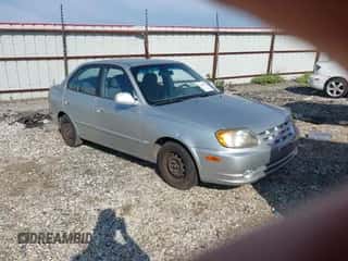 2005 Hyundai Accent GLS z VIN KMHCG45C05U611631, wystawiony jako IAAI lot #43112047 z przebiegiem 171 240 mil mil oraz . Historia ofert i sprzedaży dostępna na DreamBid. Obrazek 1.