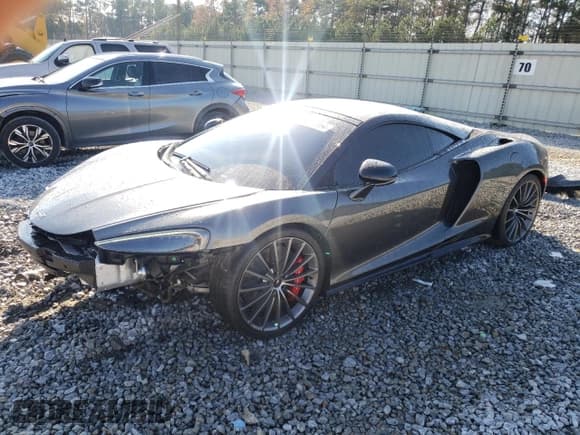 ✅ 2021 McLaren GT • VIN: SBM22GCA8MW001374 • Lot: 82147064. Listed on Copart with 32,562 mi. Free auction sales archive from the USA and detailed vehicle history report at DreamBid. Image 1.