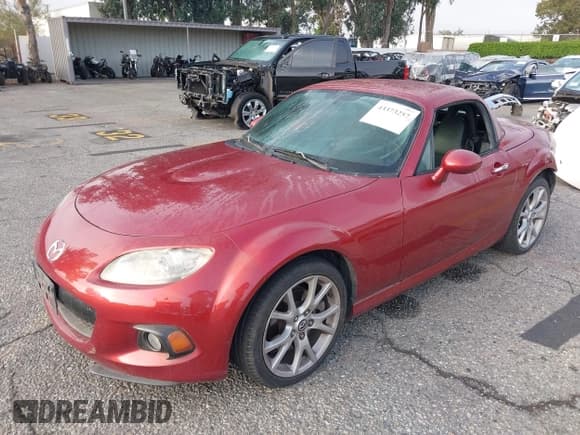 ✅ 2015 Mazda MX-5 Miata Grand Touring • VIN: JM1NC2PF9F0241793 • Lot: 43373257. Listed on IAAI with 127,984 mi. Free auction sales archive from the USA and detailed vehicle history report at DreamBid. Image 2.