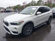 ✅ 2018 BMW X1 xDrive28i • VIN: WBXHT3C37J5K23998 • Lot: 43627488. Listed on IAAI with 153,000 mi. Free auction sales archive from the USA and detailed vehicle history report at DreamBid. Image 2.