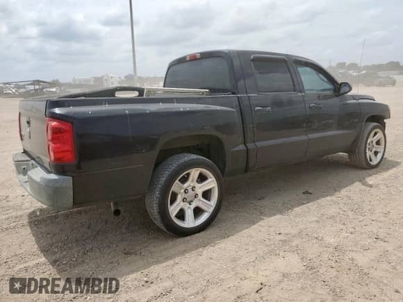 2005 Dodge Dakota ST с VIN 1D7HE28K35S235225, выставлен на аукционе Copart как лот 57684725 с пробегом 184 546 миль миль и Списание • Salvage title. История ставок и продаж доступна на DreamBid. Изображение 3.