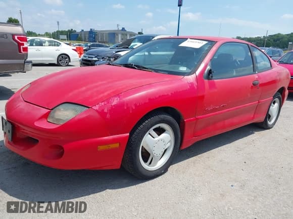 ✅ 1997 Pontiac Sunfire • VIN: 1G2JD12T3V7557090 • Лот: 42669303. Опубликован ранее на IAAI с пробегом 128 371 миль. Бесплатный доступ к архиву аукционных продаж из США и подробный отчёт об истории автомобиля на DreamBid. Изображение 2.