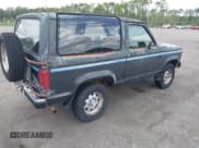 ✅ 1988 Ford Bronco • VIN: 1FMCU14T2JUE07092 • Lot: 42368100. Listed on IAAI with 157,254 mi. Free auction sales archive from the USA and detailed vehicle history report at DreamBid. Image 4.