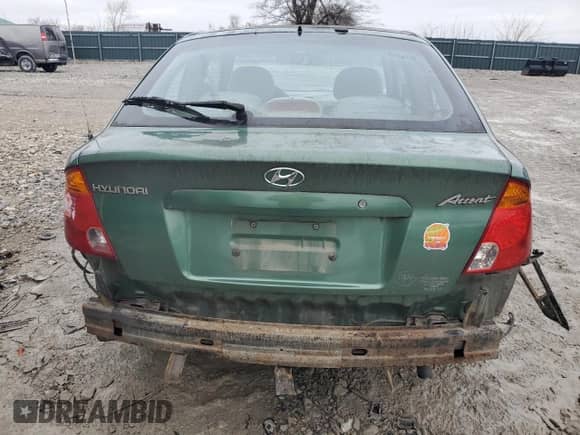 2005 Hyundai Accent GLS z VIN KMHCG35C05U356585, wystawiony jako Copart lot #40091384 z przebiegiem 60 289 mil mil oraz Szkoda całkowita • Salvage title. Historia ofert i sprzedaży dostępna na DreamBid. Obrazek 6.