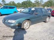 ✅ 1996 Pontiac Grand Am SE • VIN: 1G2NE52M7TC721718 • Lot: 43268073. Wystawiony na IAAI z przebiegiem 115 223 mil. Bezpłatny archiwum sprzedaży aukcyjnych z USA i szczegółowy raport historii pojazdu na DreamBid. Zdjęcie 2.