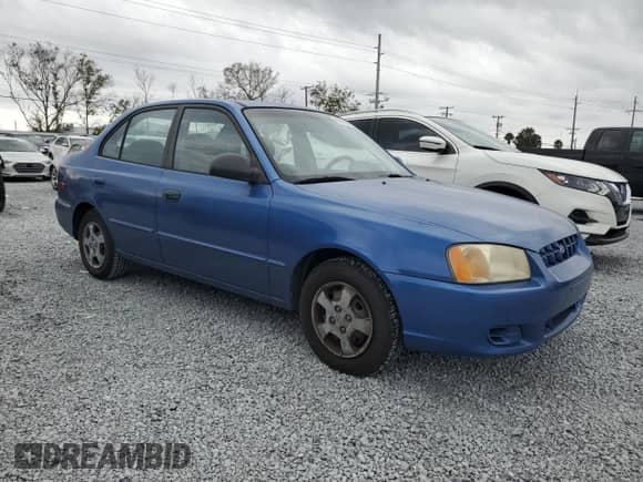 2002 Hyundai Accent GL z VIN KMHCG45C82U355914, wystawiony jako Copart lot #89006295 z przebiegiem 60 907 mil mil oraz Czysty tytuł • Clean title. Historia ofert i sprzedaży dostępna na DreamBid. Obrazek 4.