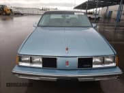 ✅ 1986 Oldsmobile 88 • VIN: 1G3HY6931G1848954 • Lot: 81999144. Wystawiony na Copart z przebiegiem Nie podano. Bezpłatny archiwum sprzedaży aukcyjnych z USA i szczegółowy raport historii pojazdu na DreamBid. Zdjęcie 5.