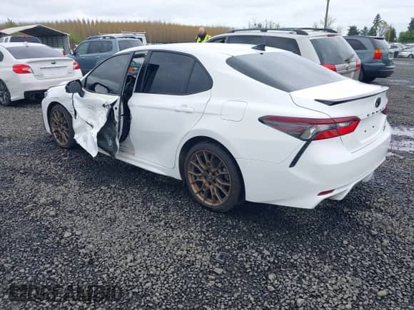 2023 Toyota Camry SE with VIN 4T1G11BKXPU103277, listed as a IAAI auction lot 41978396 with 66,624 mi miles and . Bid and sale history available at DreamBid. Image 3.