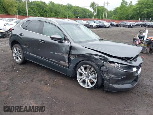 ✅ 2023 Mazda CX-30 S Premium • VIN: 3MVDMBDM9PM570034 • Lot: 42472588. Listed on IAAI with 30,715 mi. Free auction sales archive from the USA and detailed vehicle history report at DreamBid. Image 1.