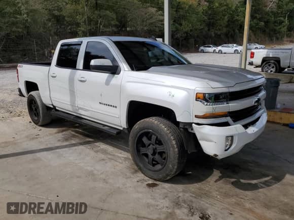 2018 Chevrolet Silverado 1500 LT с VIN 3GCUKREC1JG479772, выставлен на аукционе Copart как лот 82239365 с пробегом 92 822 миль миль и Списание • Salvage title. История ставок и продаж доступна на DreamBid. Изображение 4.
