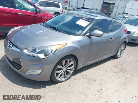 2012 Hyundai Veloster w/Black Int with VIN KMHTC6ADXCU061325, listed as a IAAI auction lot 42556398 with 122,954 mi miles and . Bid and sale history available at DreamBid. Image 2.
