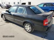 ✅ 2000 Mazda Protege DX • VIN: JM1BJ2220Y0239835 • Lot: 80228864. Wystawiony na Copart z przebiegiem 200 936 mil. Bezpłatny archiwum sprzedaży aukcyjnych z USA i szczegółowy raport historii pojazdu na DreamBid. Zdjęcie 2.