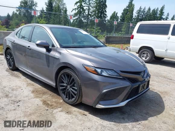 2021 Toyota Camry Hybrid XSE with VIN 4T1K31AK2MU559887, listed as a IAAI auction lot 42487632 with 24,069 mi miles and . Bid and sale history available at DreamBid. Image 1.