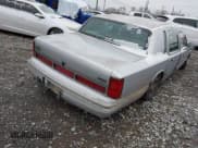 ✅ 1997 Lincoln Town Car Cartier • VIN: 1LNLM83W7VY634832 • Lot: 41245003. Listed on IAAI with 17,911 mi. Free auction sales archive from the USA and detailed vehicle history report at DreamBid. Image 4.