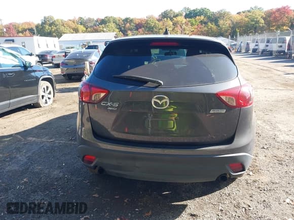 ✅ 2016 Mazda CX-5 Touring • VIN: JM3KE4CY5G0716056 • Lot: 43521281. Listed on IAAI with 107,968 mi. Free auction sales archive from the USA and detailed vehicle history report at DreamBid. Image 16.