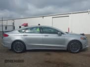 ✅ 2017 Ford Fusion Hybrid Titanium • VIN: 3FA6P0RU3HR188204 • Лот: 42618604. Опубликован ранее на IAAI с пробегом 104 609 миль. Бесплатный доступ к архиву аукционных продаж из США и подробный отчёт об истории автомобиля на DreamBid. Изображение 13.