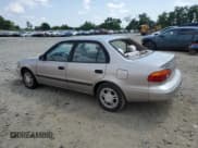 ✅ 2000 Chevrolet Prizm • VIN: 1Y1SK5487YZ408093 • Lot: 65705355. Listed on Copart with 143,283 mi. Free auction sales archive from the USA and detailed vehicle history report at DreamBid. Image 2.