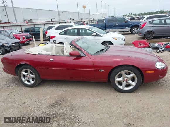 ✅ 2000 Jaguar XK • VIN: SAJJA42C2YNA02738 • Lot: 42703175. Listed on IAAI with Not provided. Free auction sales archive from the USA and detailed vehicle history report at DreamBid. Image 13.