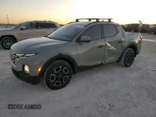 2023 Hyundai Santa Cruz SEL z VIN 5NTJC4AE7PH055234, wystawiony jako Copart lot #82275634 z przebiegiem 21 873 mil mil oraz Nie do naprawy • Non repairable. Historia ofert i sprzedaży dostępna na DreamBid. Obrazek 1.